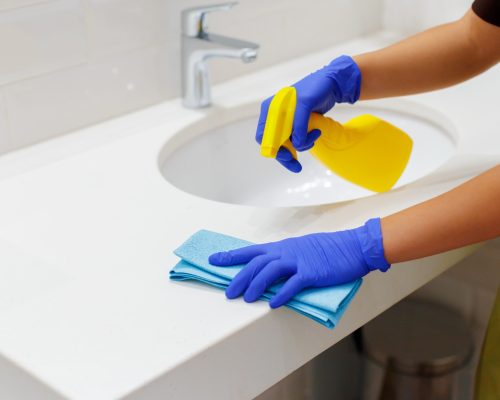 housekeeper-cleaning-hotel-room